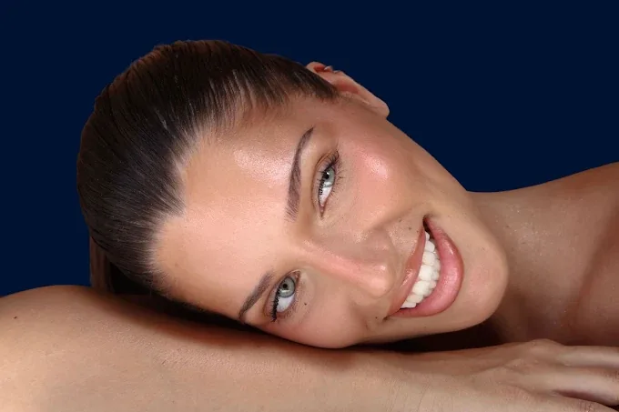A smiling client after her treatment